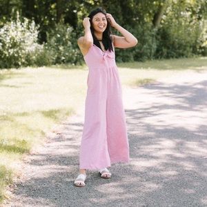 Pink linen jumpsuit with tie front